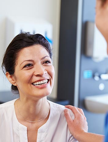 patient smiling at her doctor